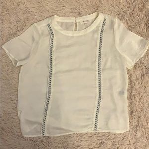 White with blue floral blouse